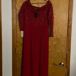 Red brand new jumpsuit never worn. Off the shoulder. Lace top and flare legs